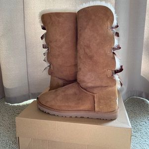Tan UGG boots with bow ties on back